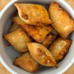 Air Fried Pizza Rolls or Pizza Bites in a bowl with cheese oozing out