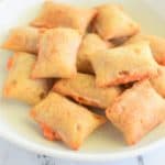 close-up of pizza rolls on white plate