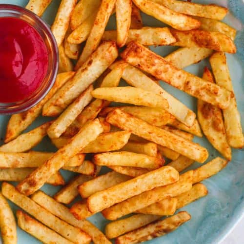 air fryer French fries on blue plate with side of ketchup