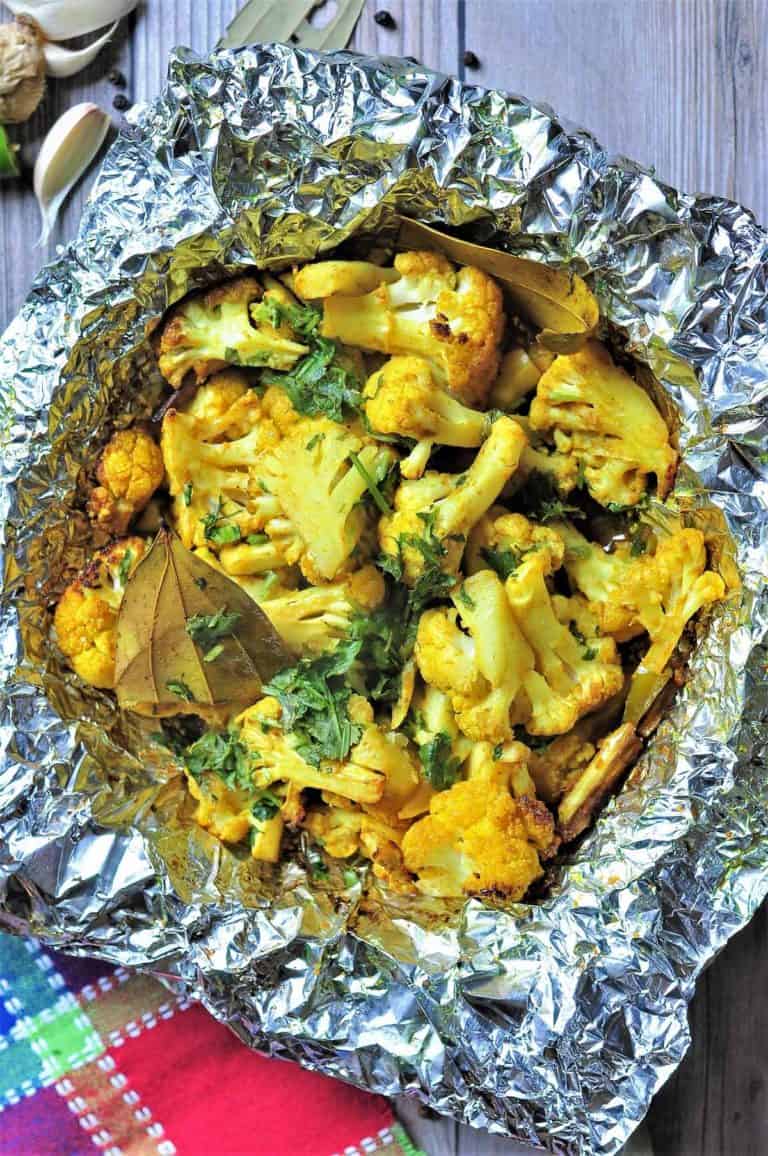 cauliflower bites with herbs in piece of foil