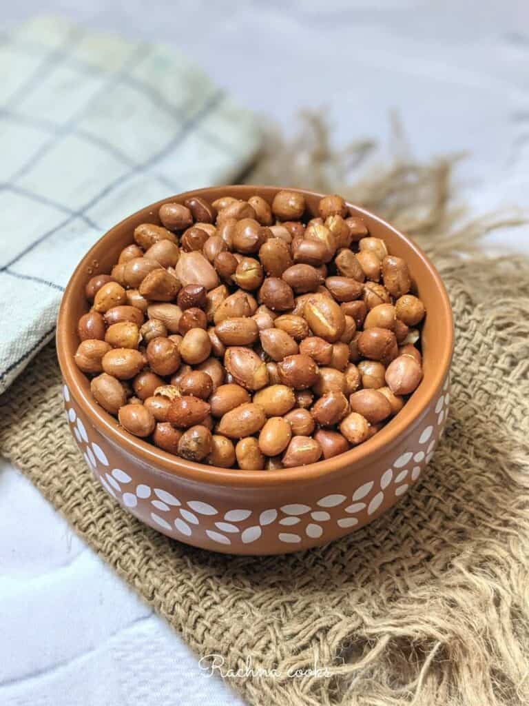 air fried peanuts in brown serving bowl with white designs on it