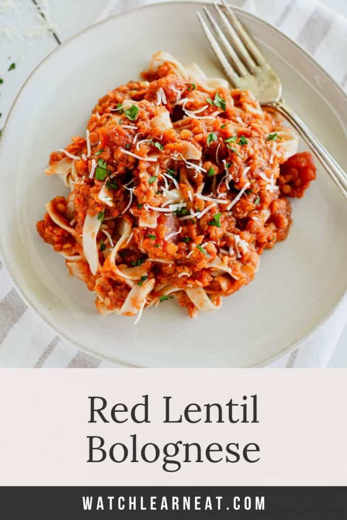 pin showing lentil bolognese mixed with pasta topped with parsley and Parmesan with text overlay