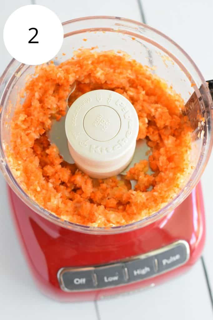 carrots, celery, onion and garlic in food processor after pulsing