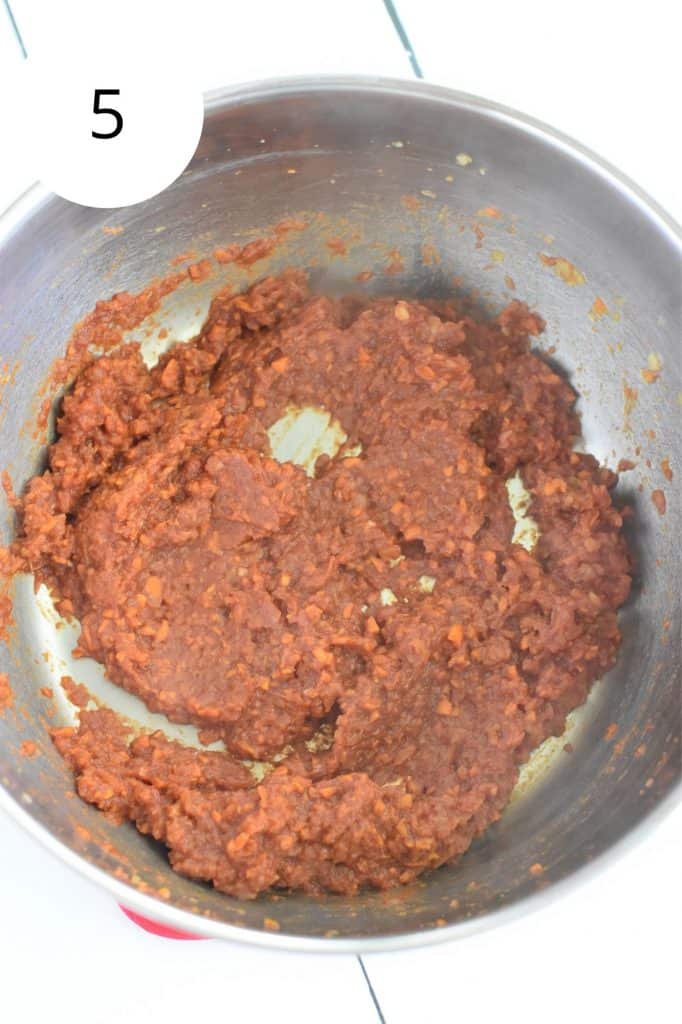 tomato paste added and cooked with the mixture