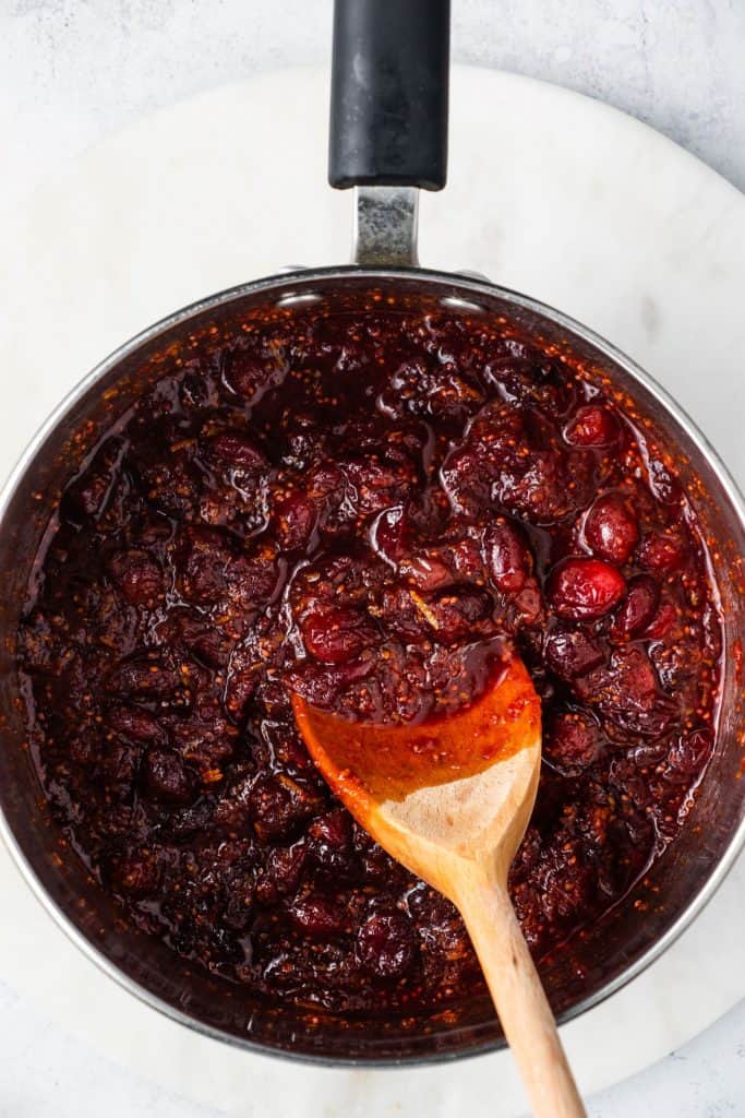 finished cranberry sauce in pan after stirring in orange juice, zest and cinnamon