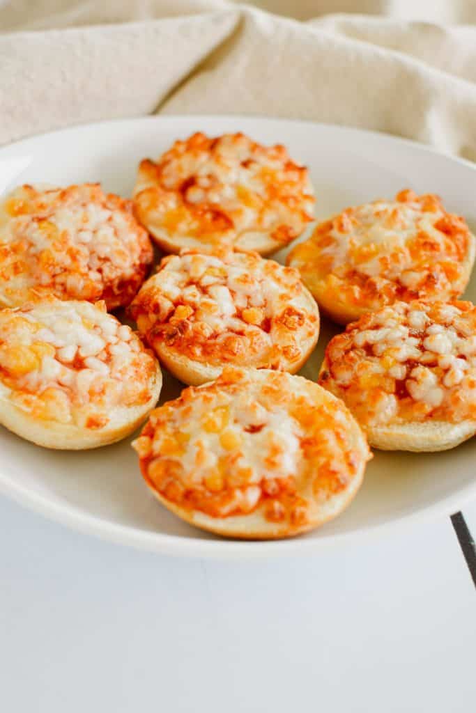 front view of bagel bites on a white plate