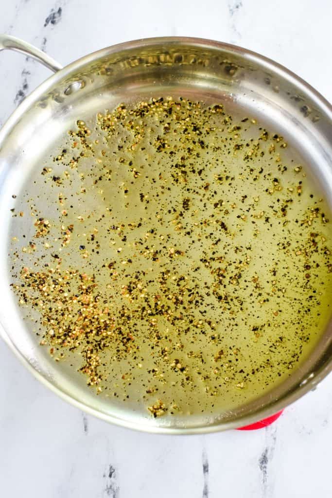 pepper and olive oil in a stainless steel sauté pan after heating together