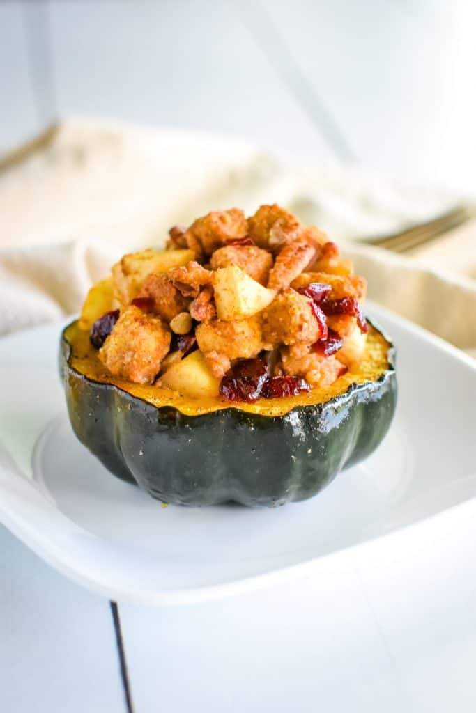 front view of serving of acorn squash on white plate