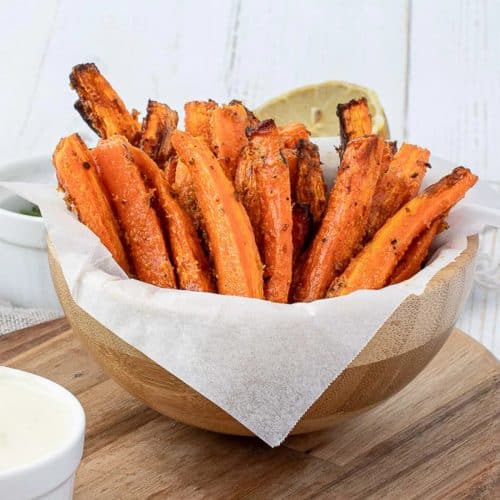 carrot fries in wooden bowl with parchment paper