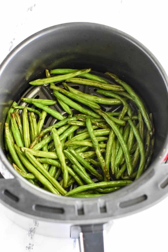green beans in air fryer after cooking.