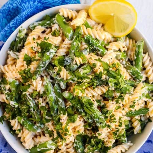 overhead of vegan lemon asparagus pasta in a bowl.