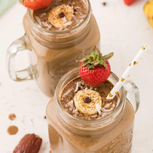 two weight gain chocolate smoothies in mason jars.