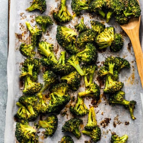 overhead of roasted broccoli on baking sheet.