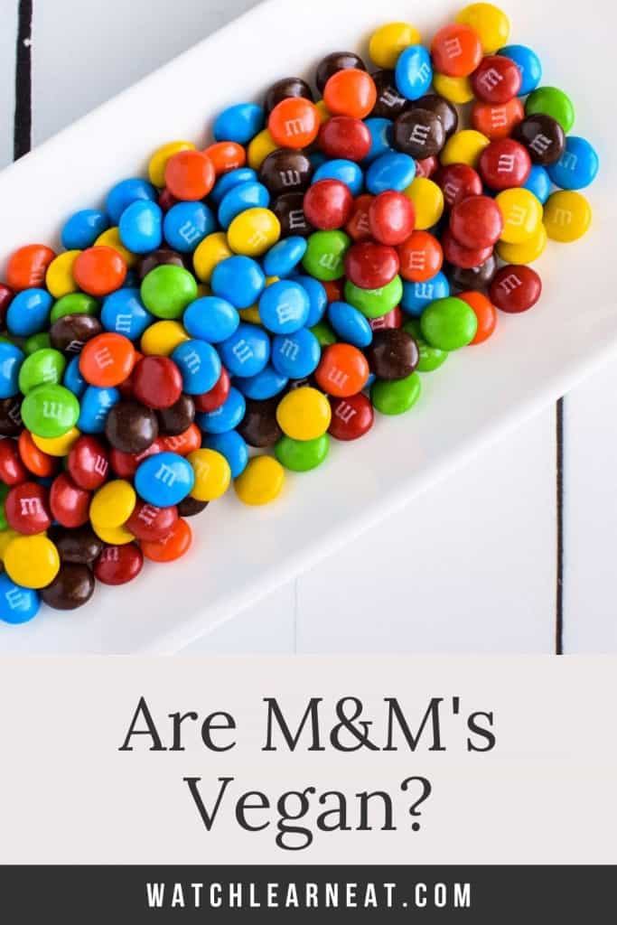 Pin showing M&M's on a plate with text title overlay.