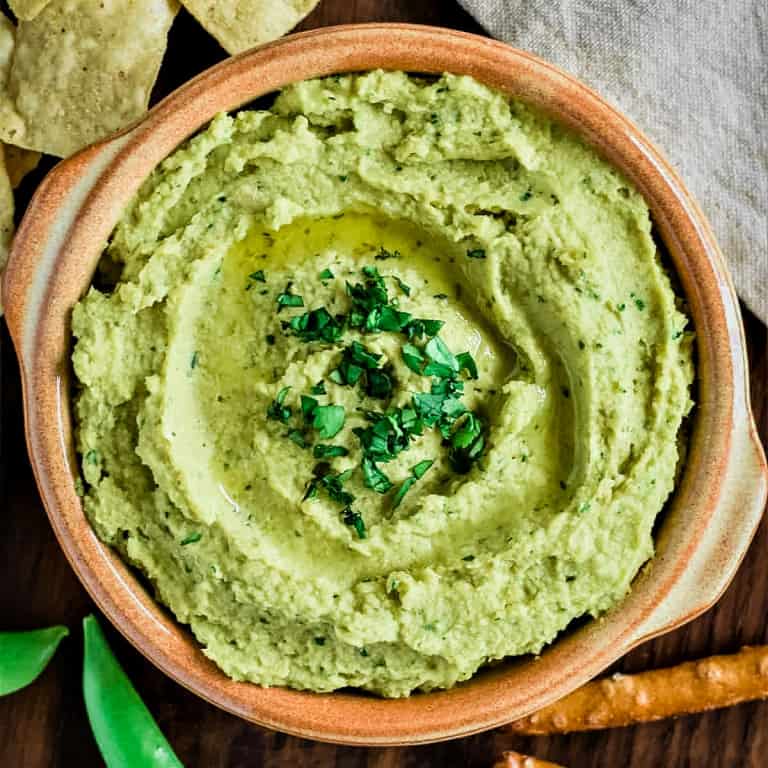 overhead of avocado hummus in a bowl.
