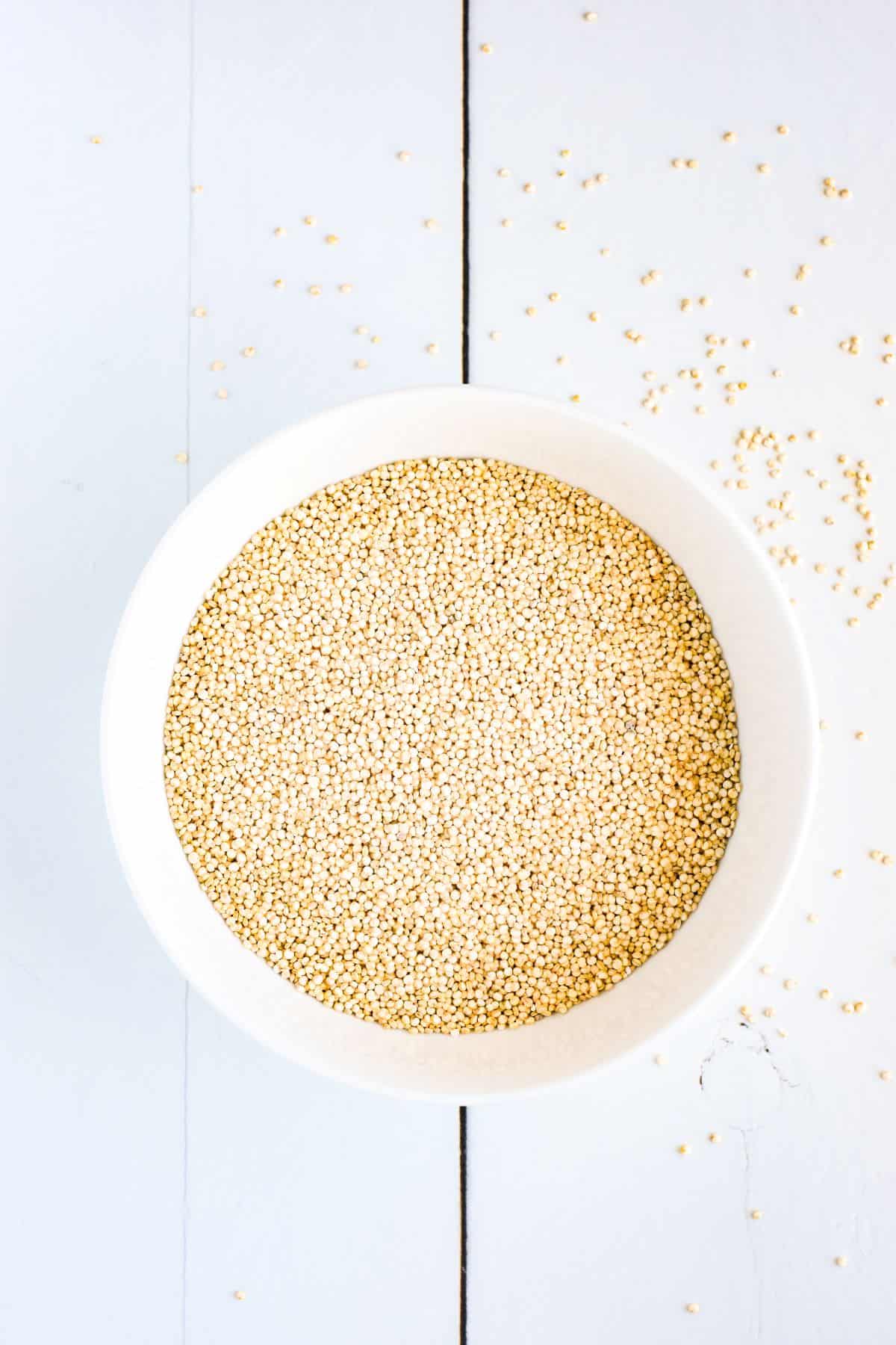 Bowl of uncooked quinoa.
