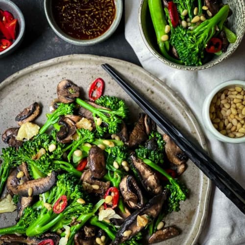 Broccolini Salad with Pan Fried Mushrooms on a dish.