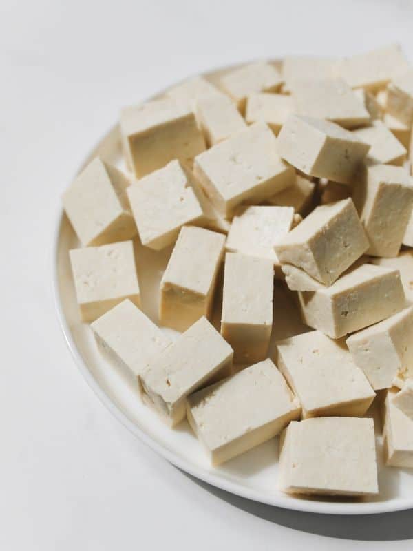 cubed tofu pieces on a white dish.