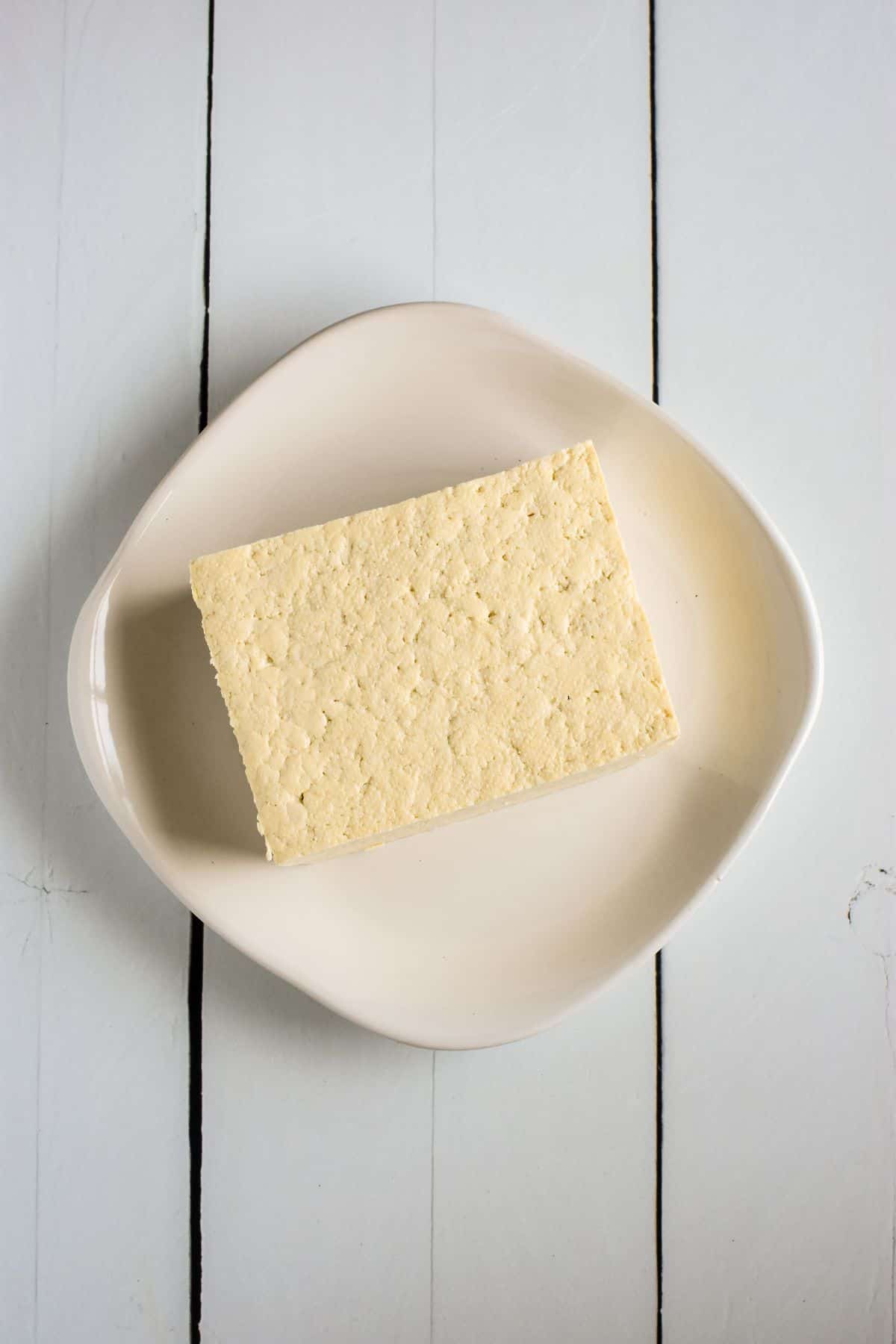 Overhead view of tofu on a plate.