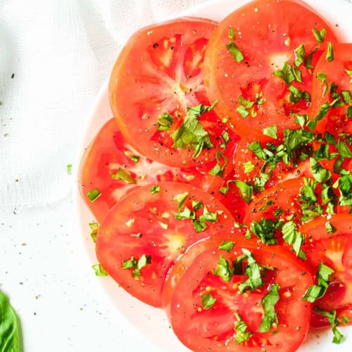 Marinated tomatoes on a dish.