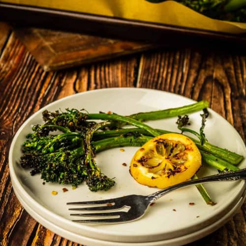 Grilled broccolini on a plate.