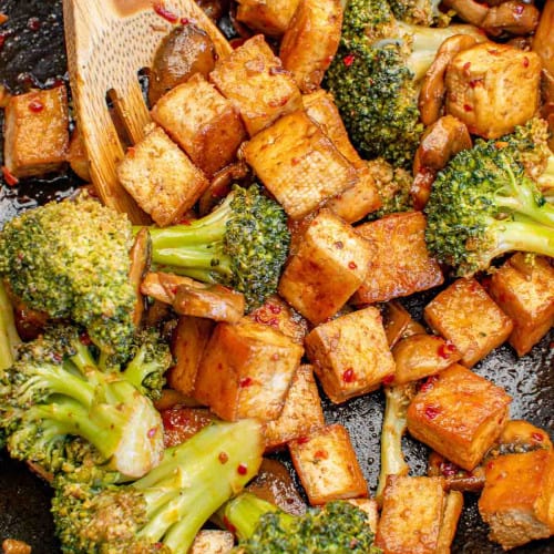 vegan tofu broccoli stir fry in a pan.