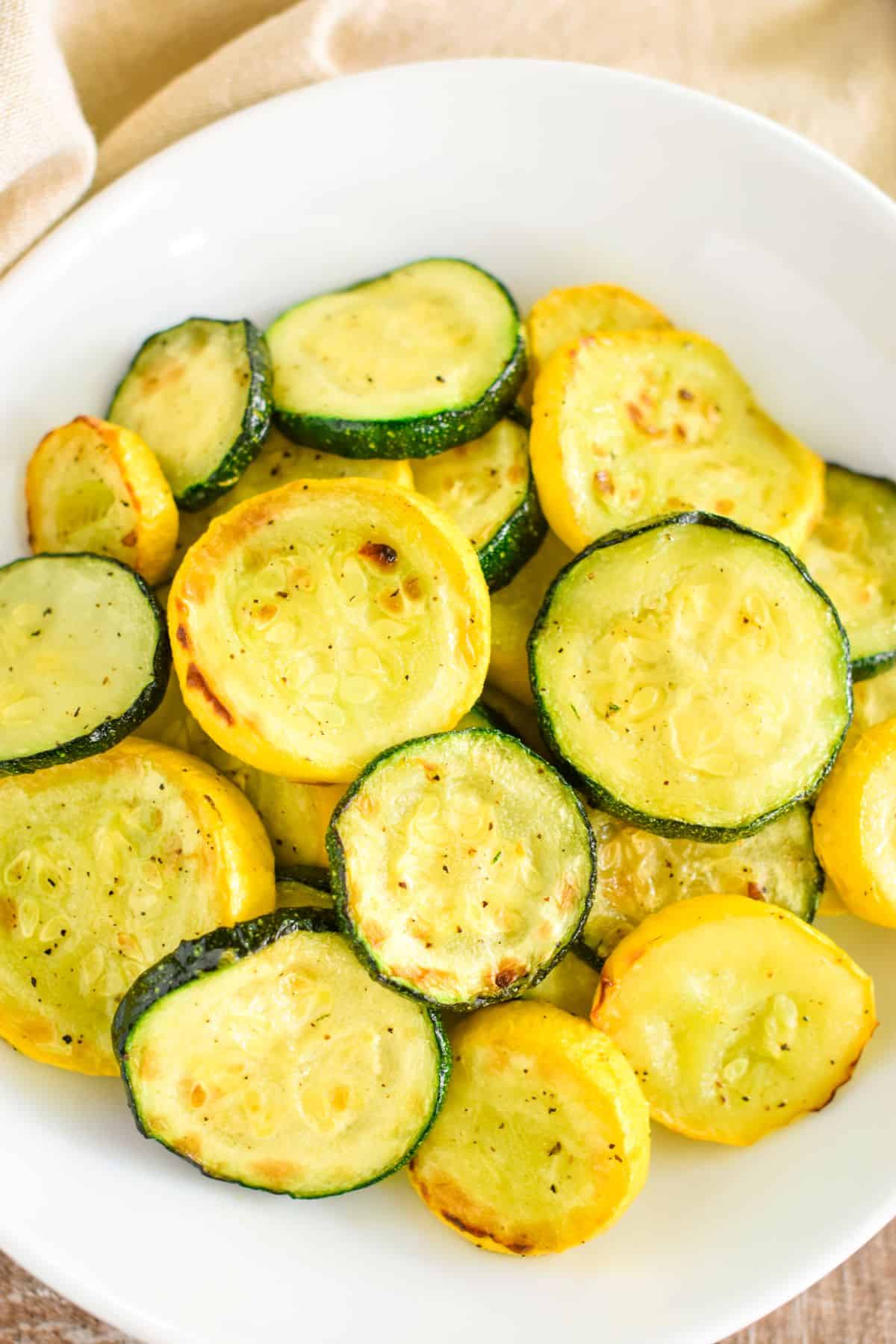 close-up of air fryer squash on a white plate.