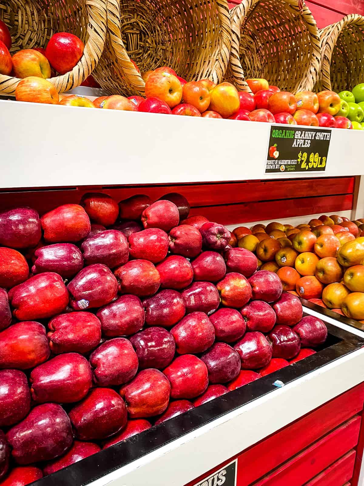 Apples on display in grocery store.