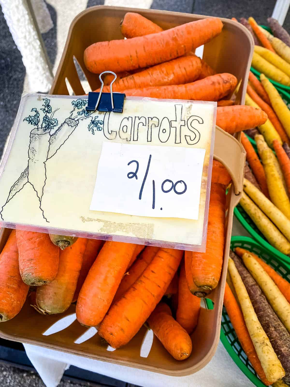 Bin of carrots at farmers market.