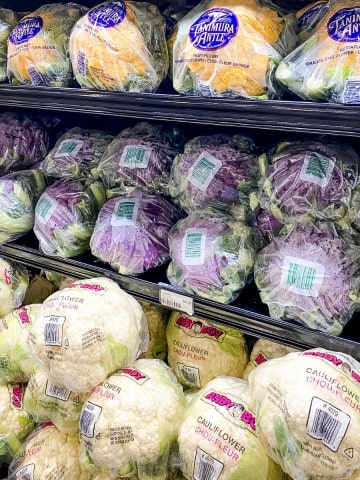 Cauliflower on shelves in supermarket.