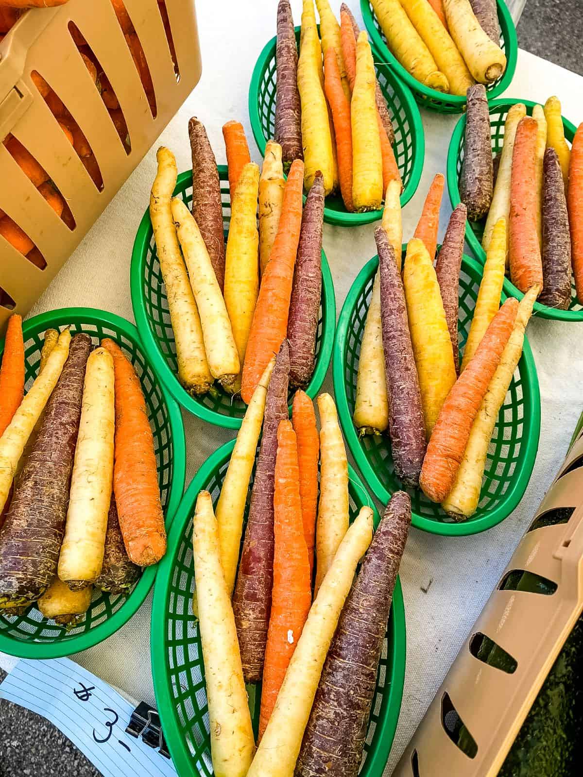 Tri-colored carrots at farmers market.