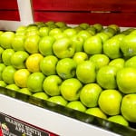 Granny Smith apples in supermarket.