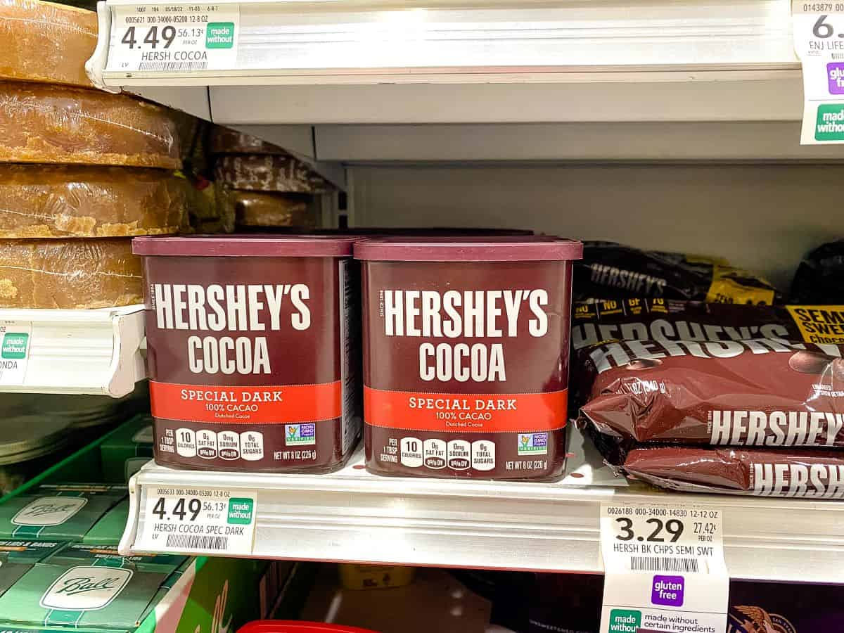 Hershey's Special Dark Cocoa Powder on supermarket shelf.