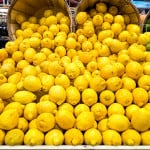 Lemons dumping out of baskets.