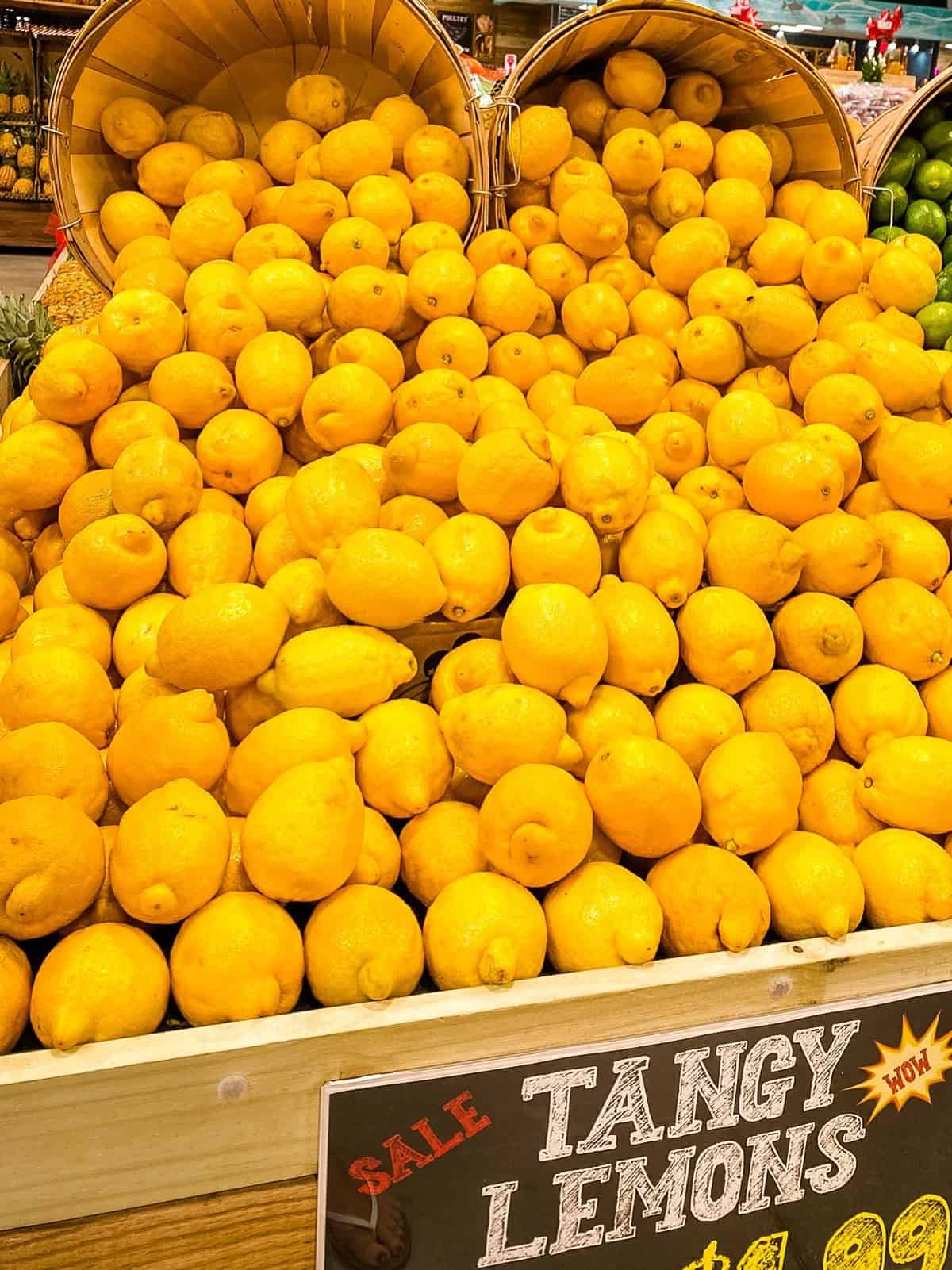 Lemons on display in supermarket.