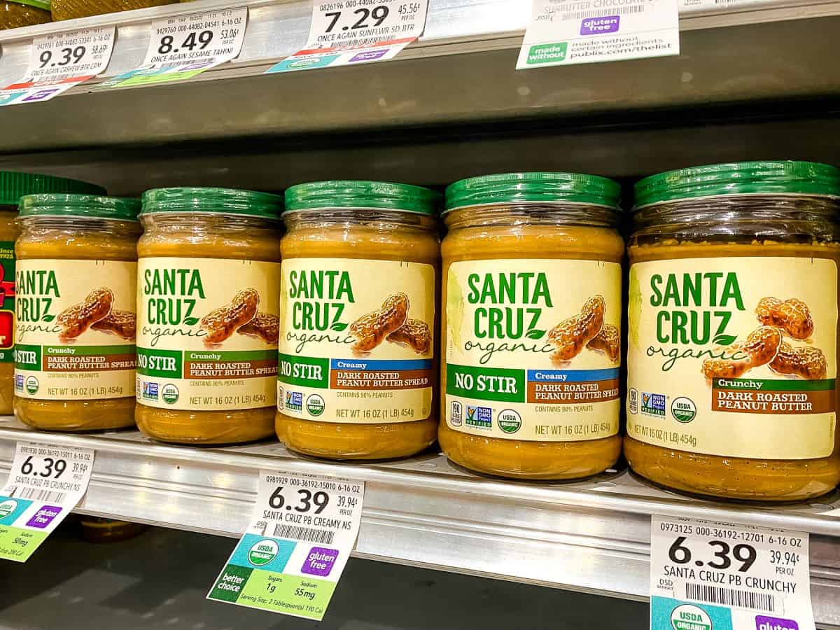 Santa Cruz peanut butter on supermarket shelf.