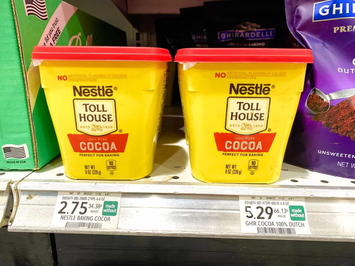 Nestle Toll House Cocoa Powder on supermarket shelf.
