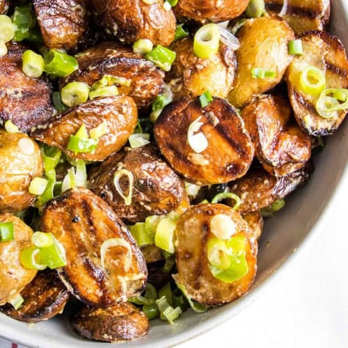 Grilled potato salad in a bowl.