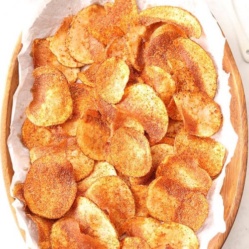 Homemade Barbecue Potato Chips in a wood bowl.
