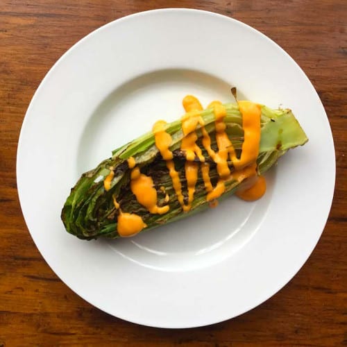 Grilled Romaine Lettuce on a plate.