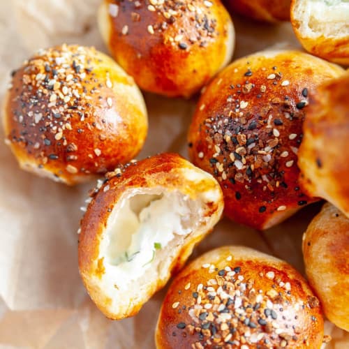 Bagel and cream cheese bites open showing filling.