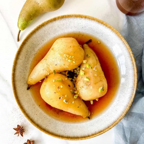 Spiced Poached Pears in a bowl.