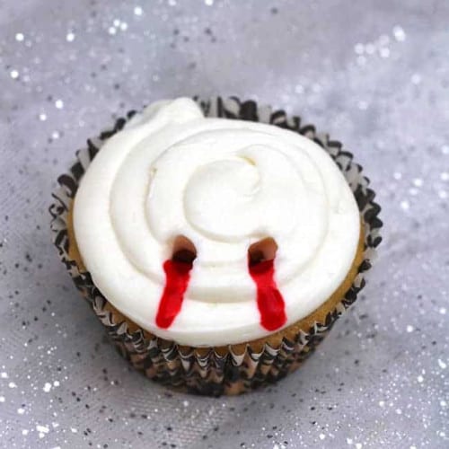 Vampire Bite Cupcake on fabric with sparkles.