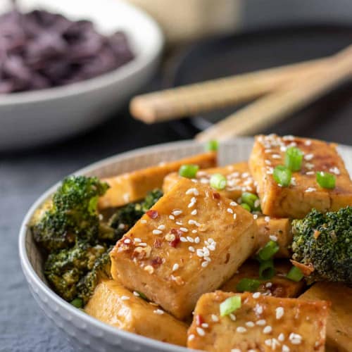 Sticky Sesame Tofu with Broccoli in a bowl.