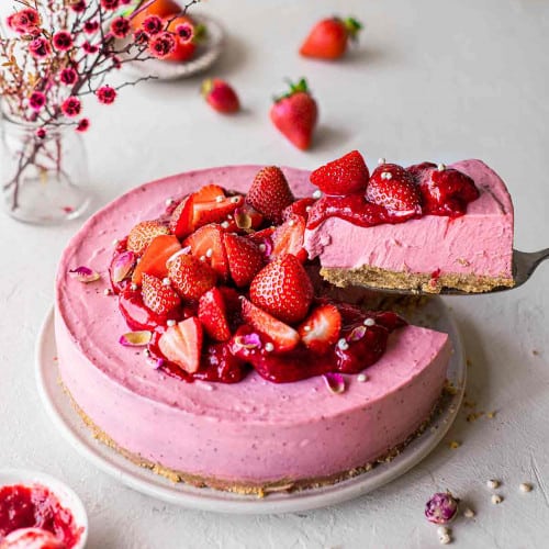 Vegan strawberry cheesecake on a plate.