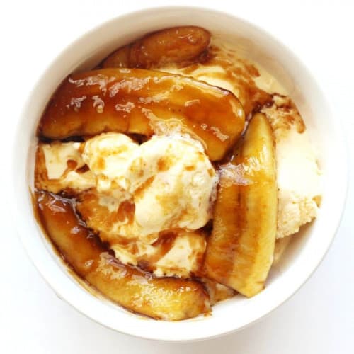 overhead of vegan bananas foster in a white bowl.