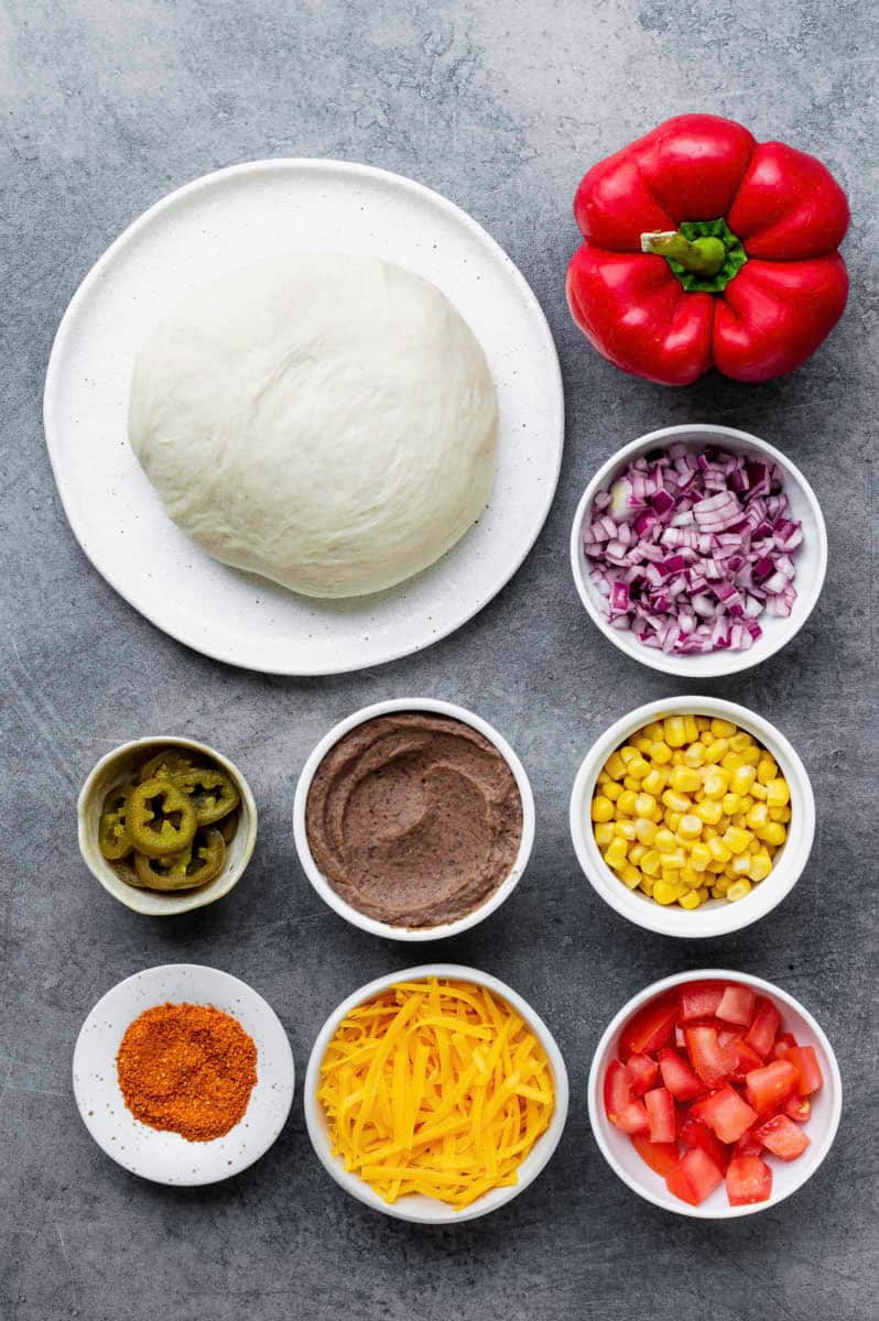 Gathered ingredients for making our vegetarian mexican pizza recipe.