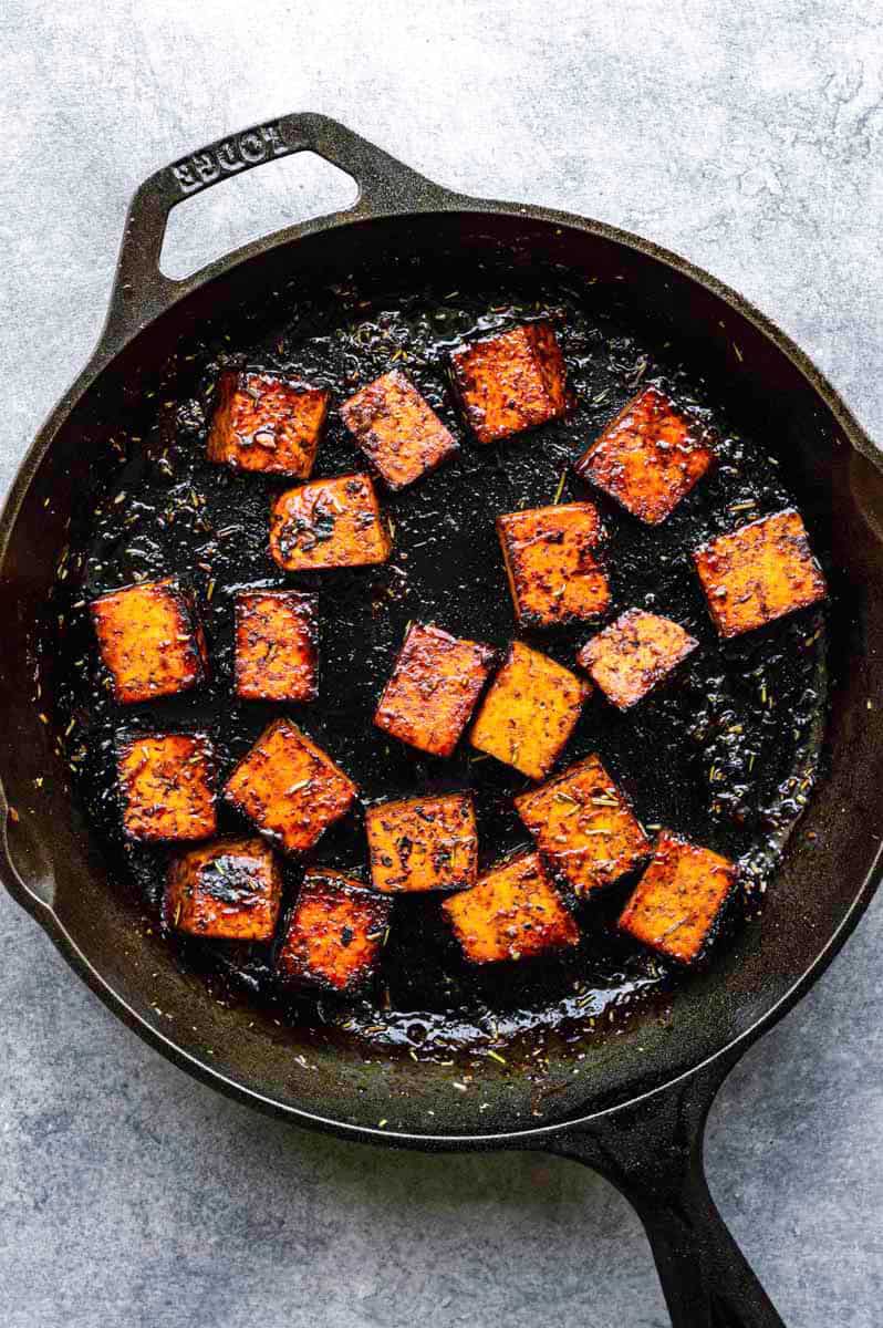 Tofu cubes after cooking in the cast iron pan.