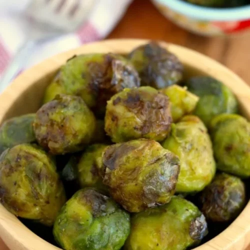 Brussels sprouts in a wooden bowl.