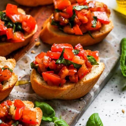 close-up of one toast with bruschetta with more around it.